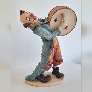 Large, cheerful clown with his drum